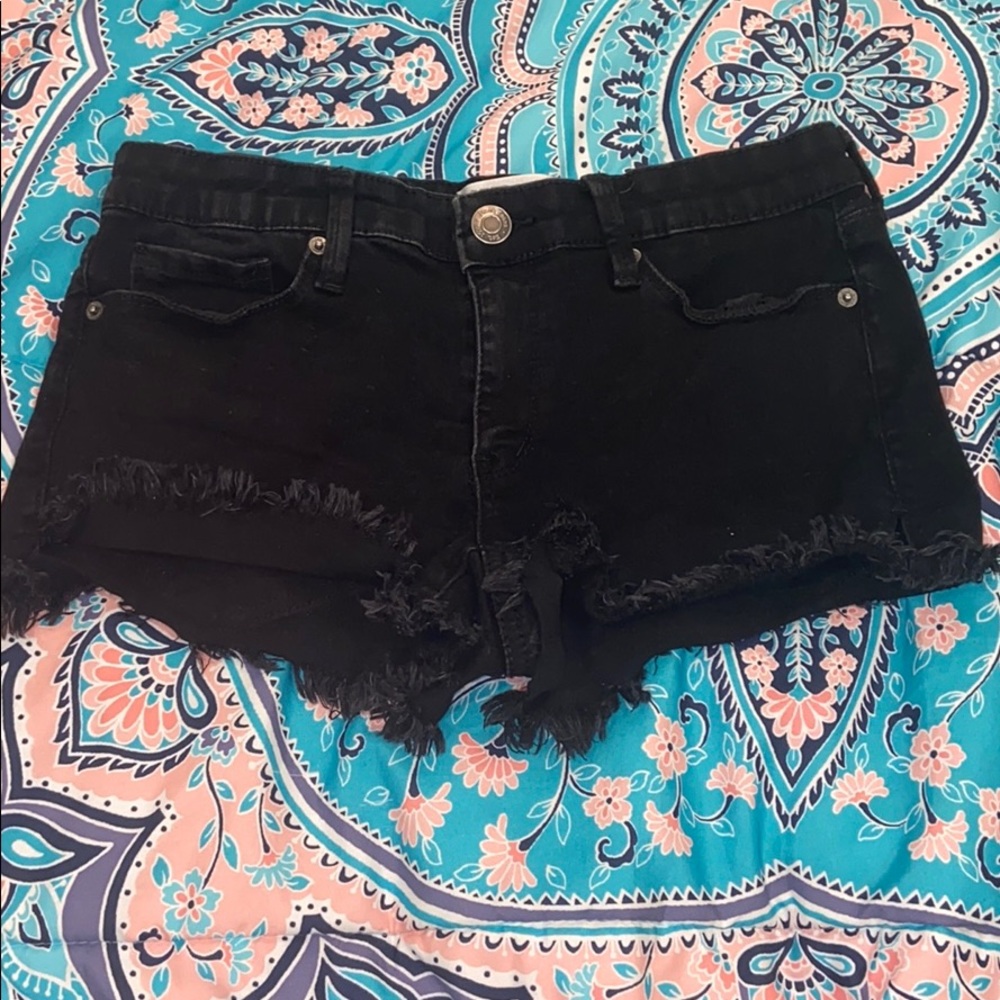 Black denim shorts.